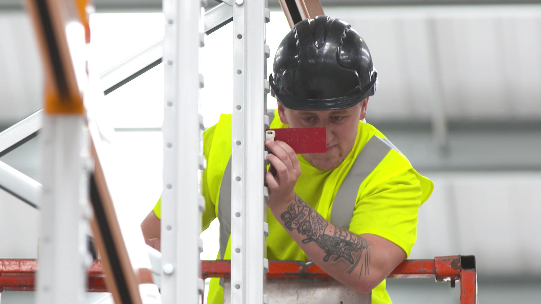 An installer undertaking a pallet racking repair